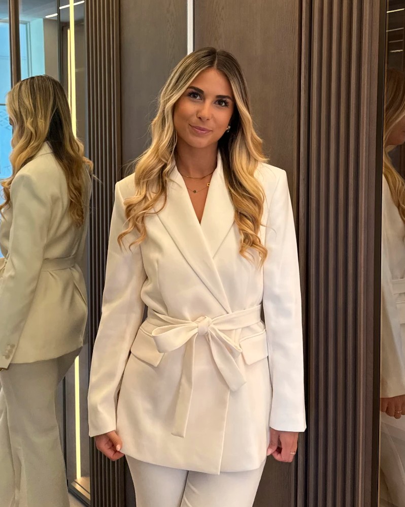 Aylin, founder of AYVA, in a cream suit